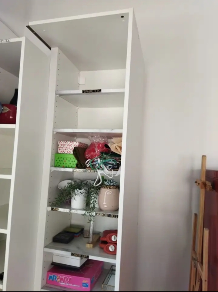 This IKEA PAX add-on corner unit with four adjustable shelves